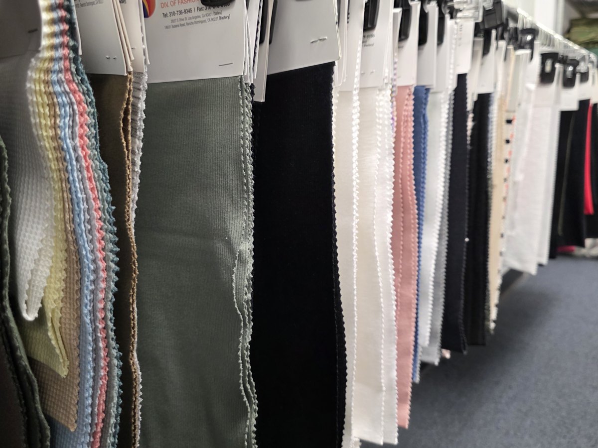 Knit fabric sample lines on a rack