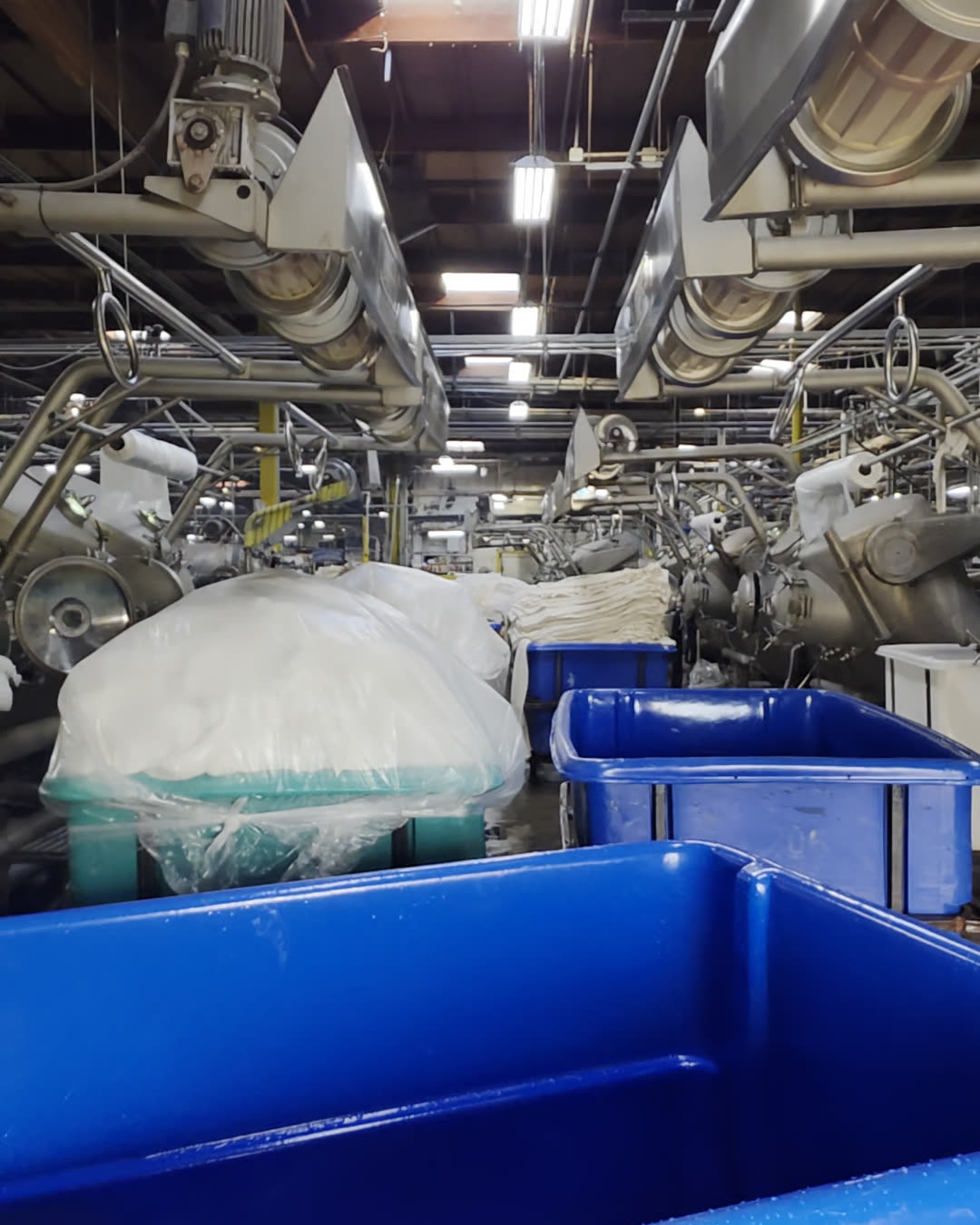 Greige fabric in bins awaiting dyeing