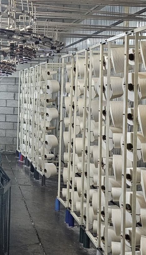 Spun yarn cones on the creel